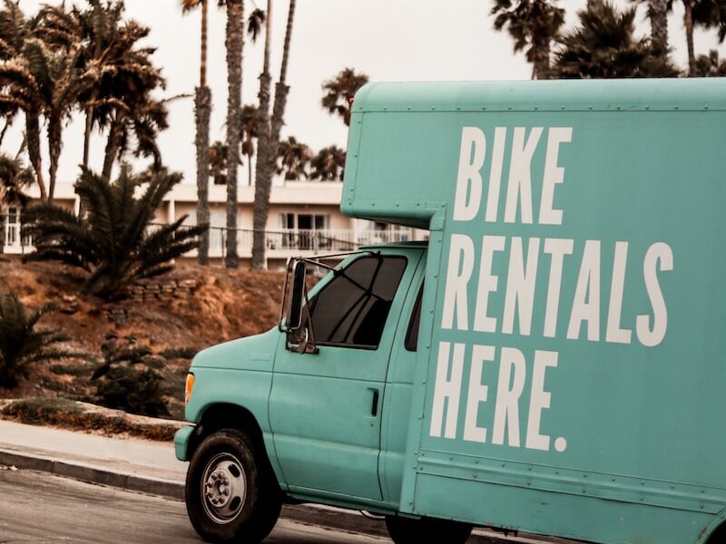 teal Bike Rentals Here. utility van